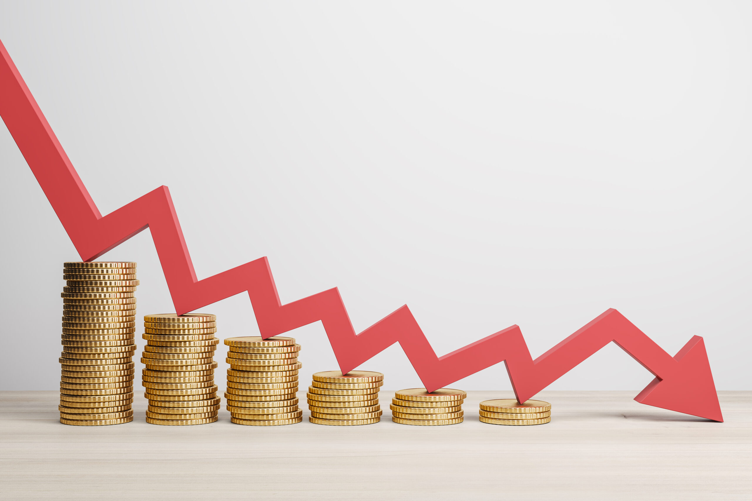 Inflation and global economy crisis concept with red arrow going down on golden coin stacks. 3D rendering